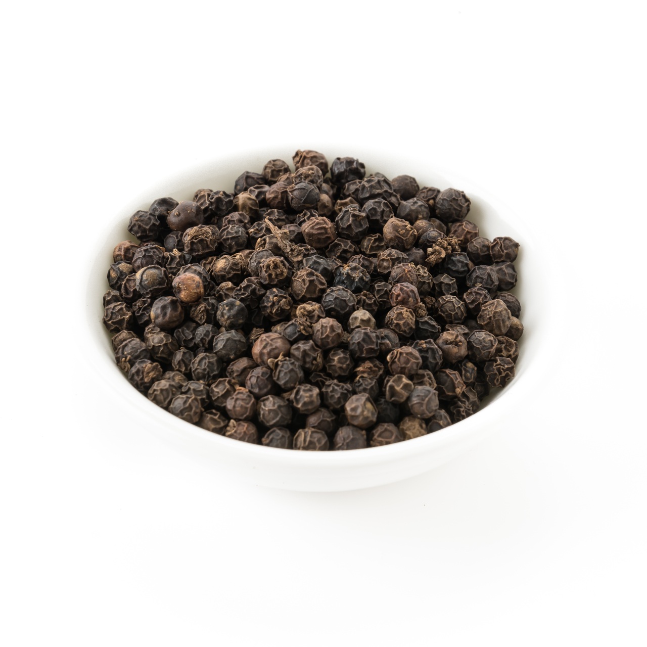 black peppers on white background